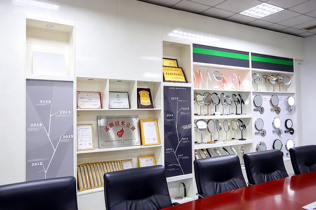 On the left, a timeline of the company's history; in the center, a display of honor certificates and medals; on the right, shelves holding a range of L…