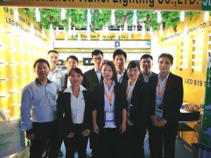 Trade show booth of Tianci Lighting with LED R7S and S19 tube displays and the export team.
